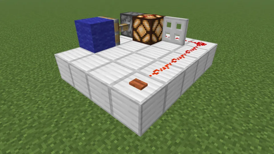 アカシアのボタンでレッドストーン信号を発信する様子