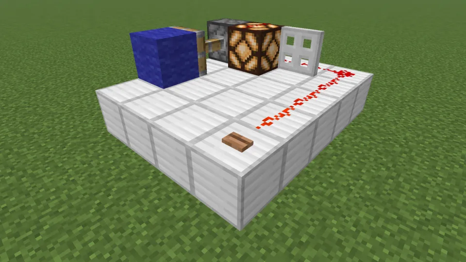 ジャングルのボタンでレッドストーン信号を発信する様子